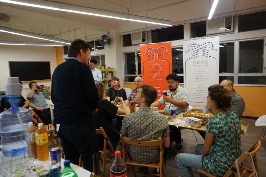 Trebor talking to a small group of people at the Platform Cooperativism Consortium's 2018 conference in Hong Kong.