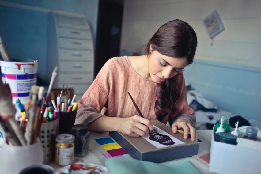 Woman painting.